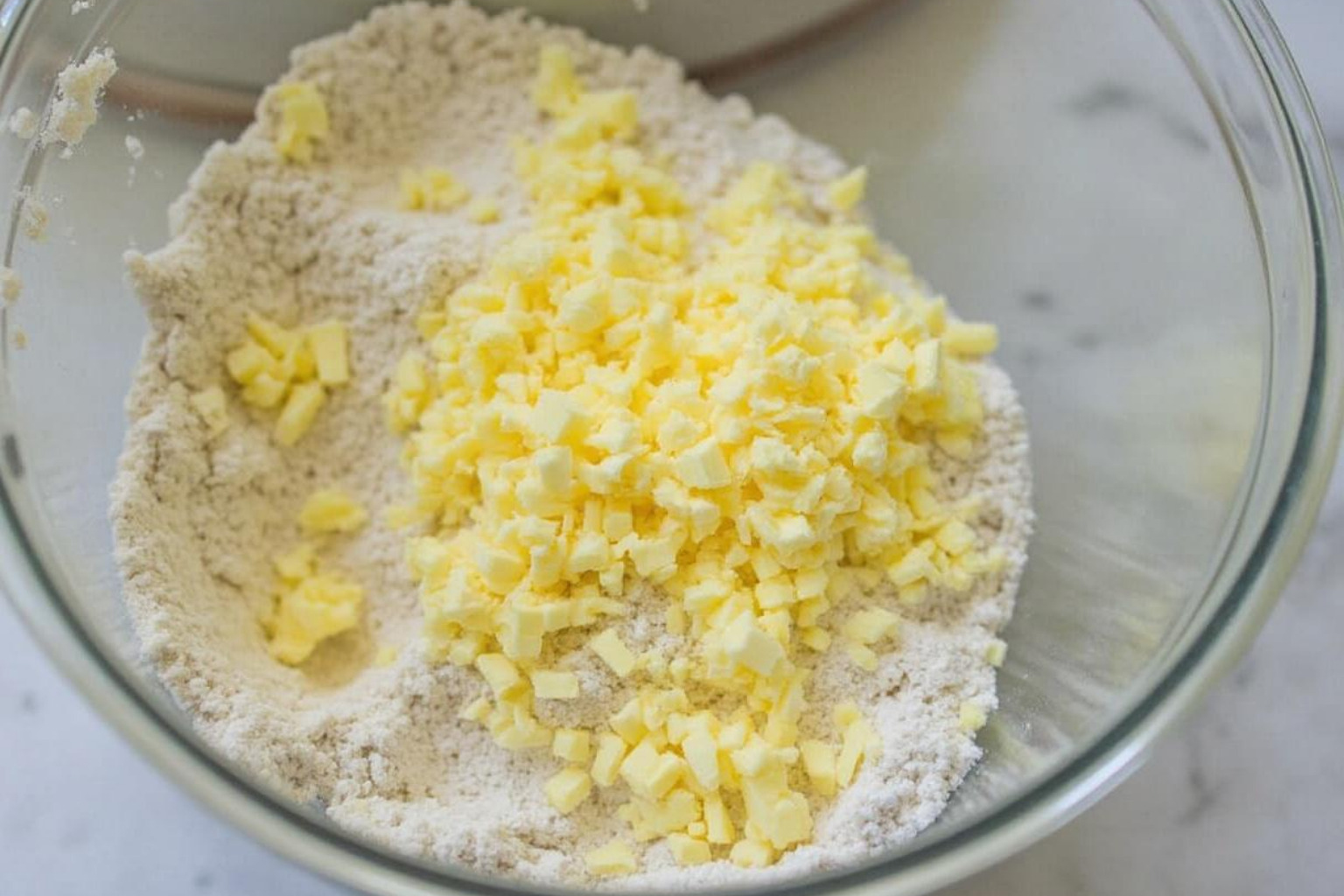 grated frozen butter on flour mixture - scones