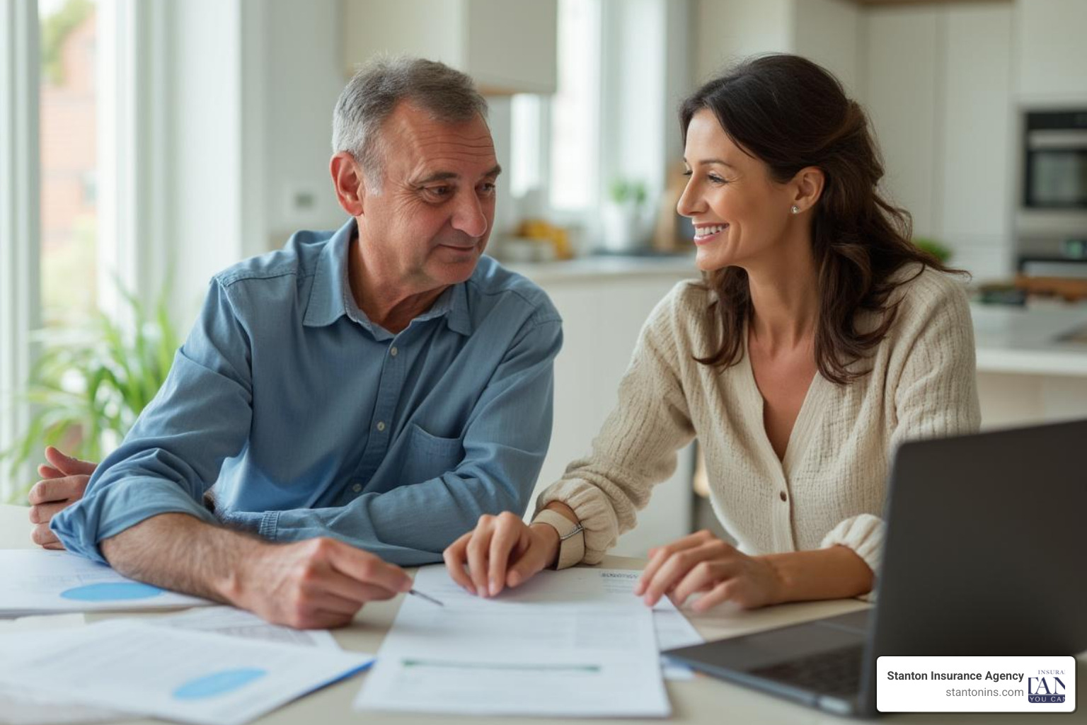 Homeowner reviewing insurance policy documents with agent - Insurance Agencies Massachusetts