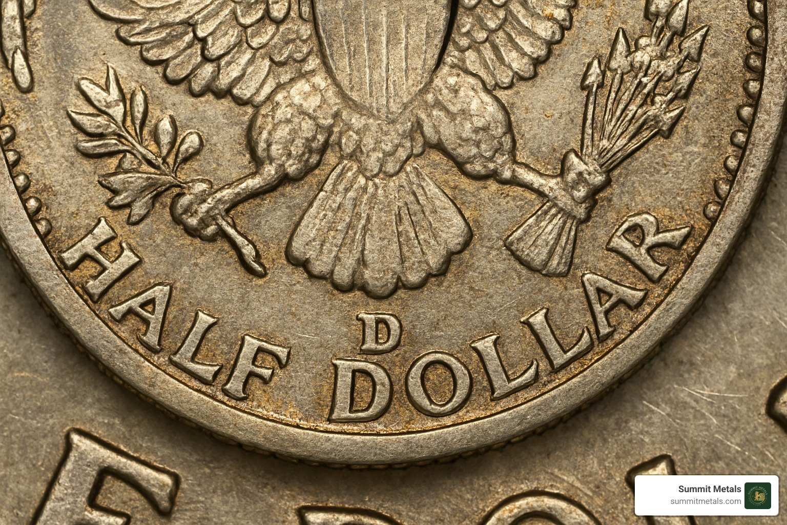 close-up of mint mark on half dollar showing location and detail - half dollar coin value