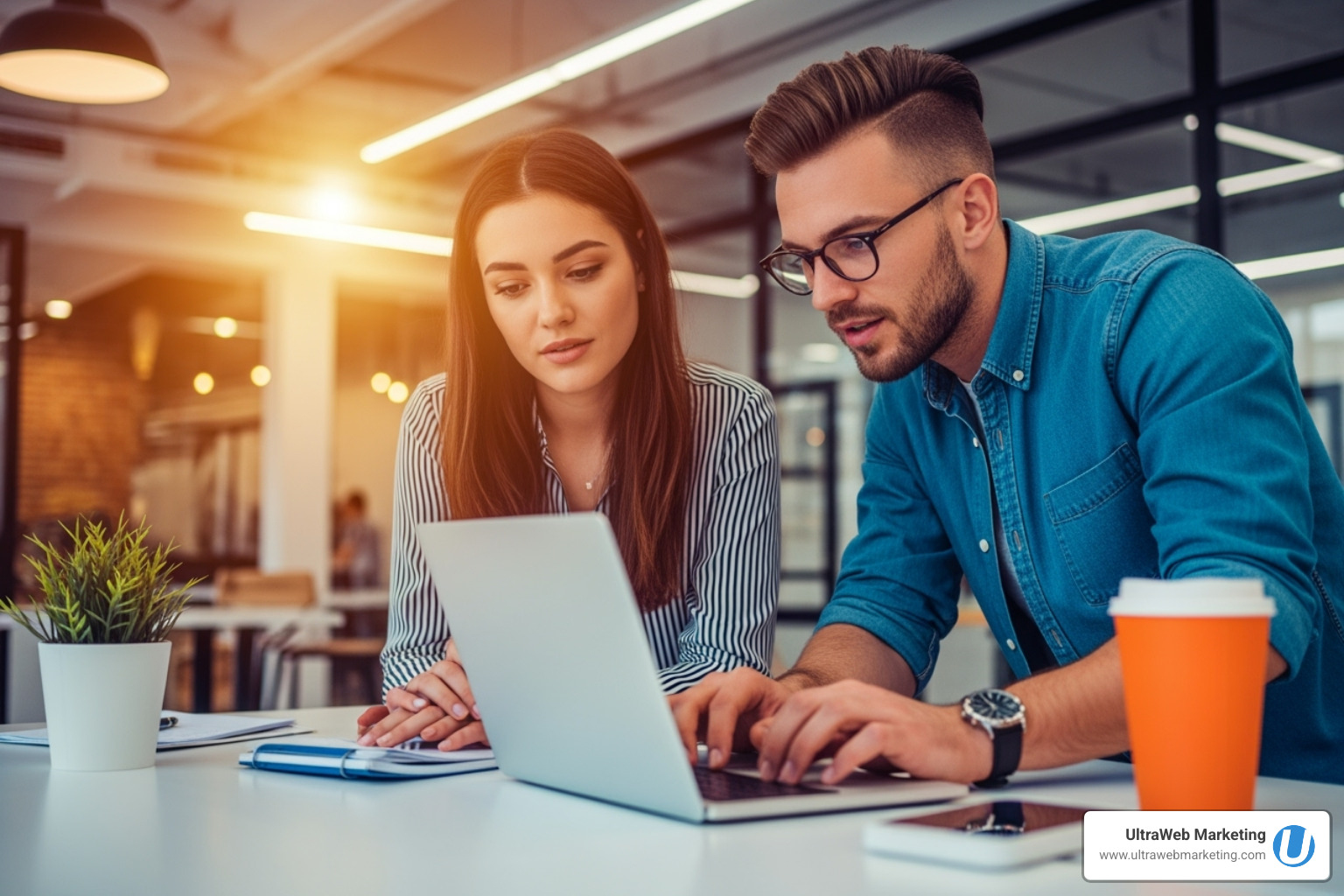 UltraWeb Marketing's team collaborating with a client around a whiteboard - search engine marketing agency near me