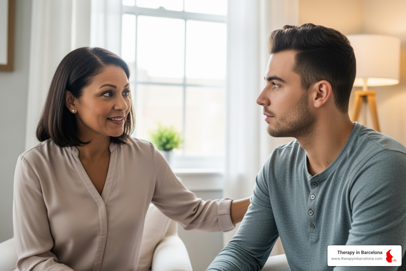 Two people in a warm, understanding conversation, possibly a therapist and client, in a comfortable setting. - English therapy Madrid Two people in a warm, understanding conversation, possibly a therapist and client, in a comfortable setting. - English therapy Madrid