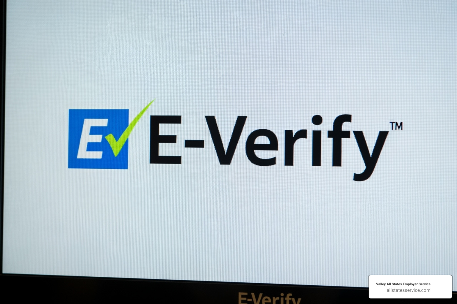 E-Verify logo on a computer screen - workforce eligibility verification