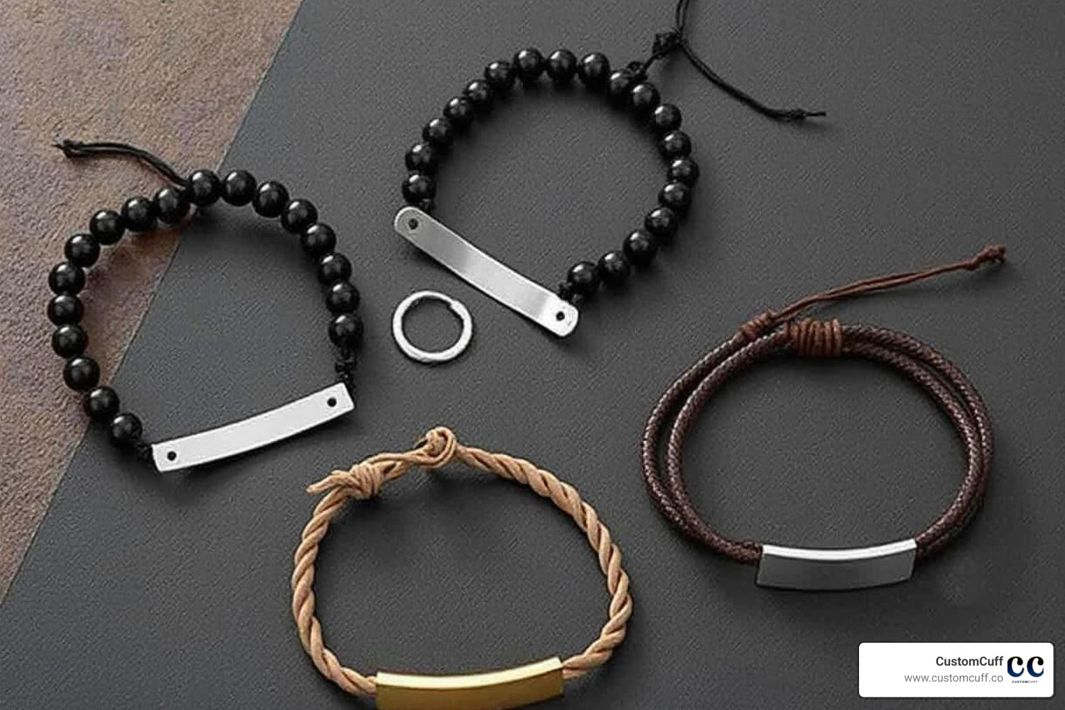 Flat lay featuring four CustomCuff recommended bracelet styles against a stylish, masculine background - engraved bracelet for boyfriend