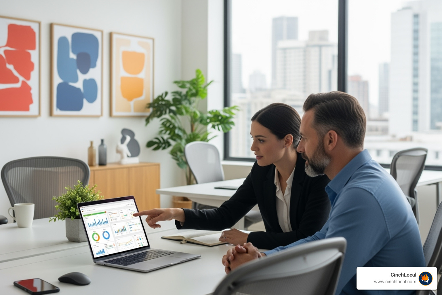a contractor and a marketing professional reviewing a digital strategy on a laptop in a modern office setting. - contractor seo agency