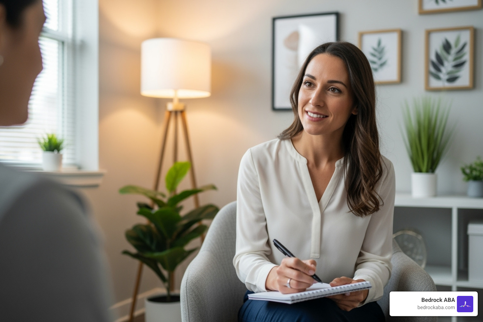 A behavioral therapist taking notes during a session with a client - behavioral therapist