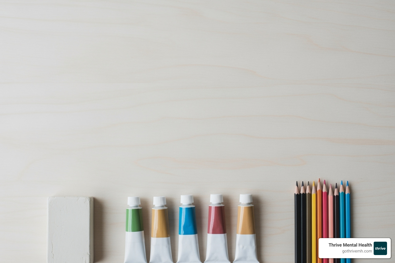 various art supplies like clay, paints, and colored pencils arranged neatly - art therapy activities for anxiety