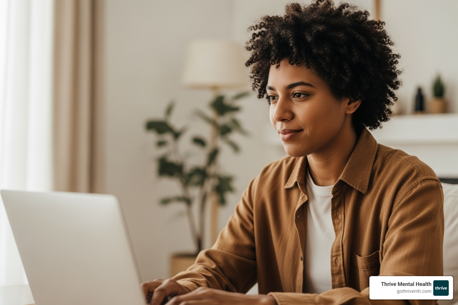 a person talking to a therapist via telehealth on a laptop - adult outpatient mental health