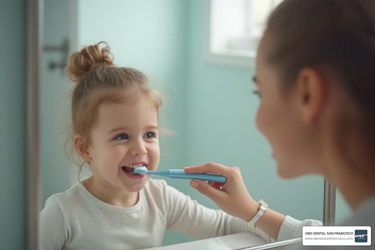 A parent helping their young child brush their teeth in front of a bathroom mirror. - pediatric dental care A parent helping their young child brush their teeth in front of a bathroom mirror. - pediatric dental care