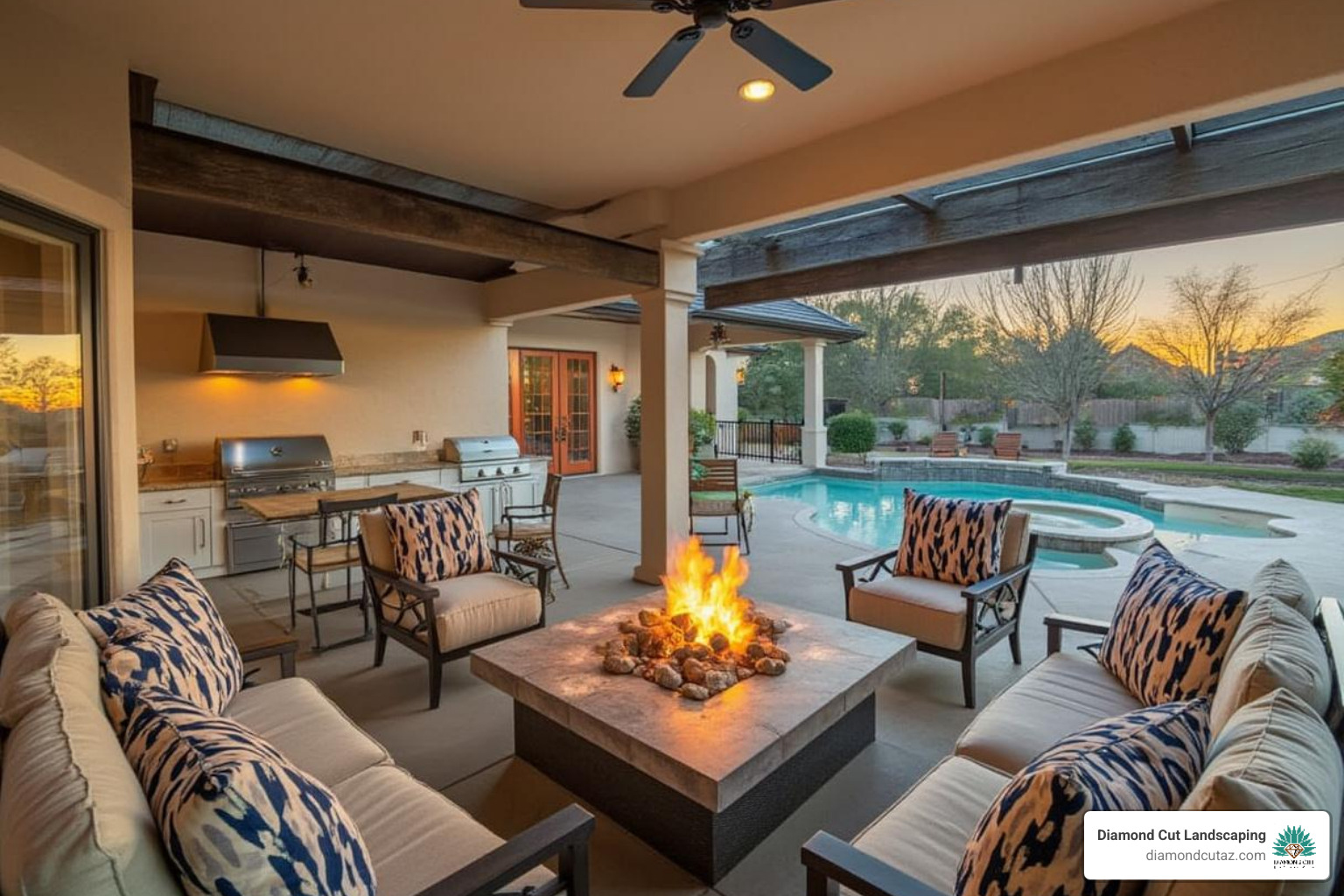 cozy outdoor living area with a fire pit and an outdoor kitchen adjacent to the pool - phoenix backyard pool and landscape designs