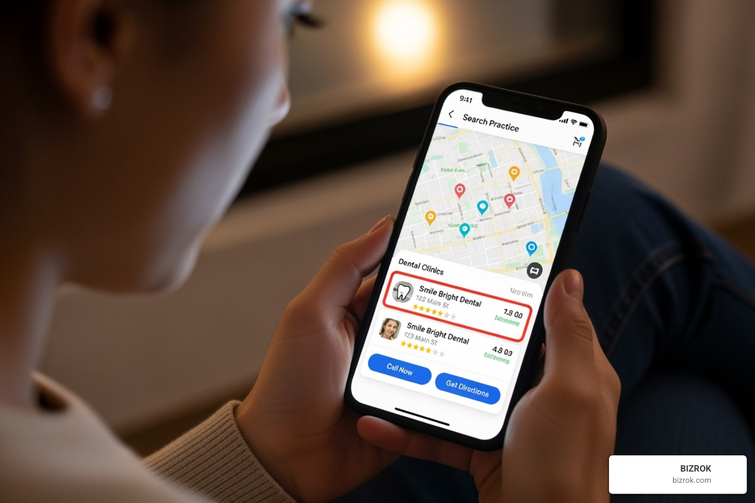 A person using a smartphone to find a dental practice, with a clean, modern interface displaying search results and practice information. - Grow dental practice