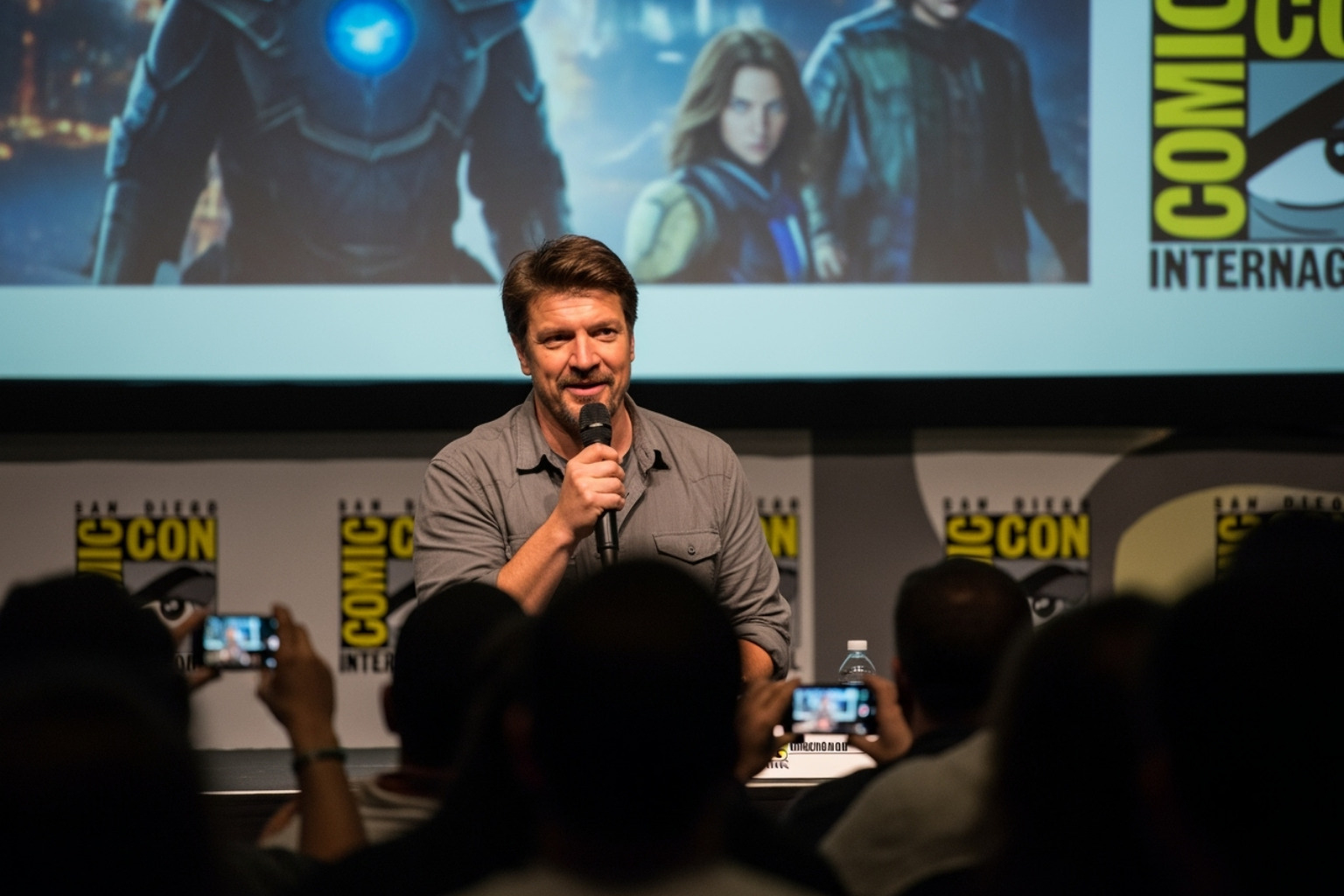Nathan Fillion at a comic convention panel - nathan fillion