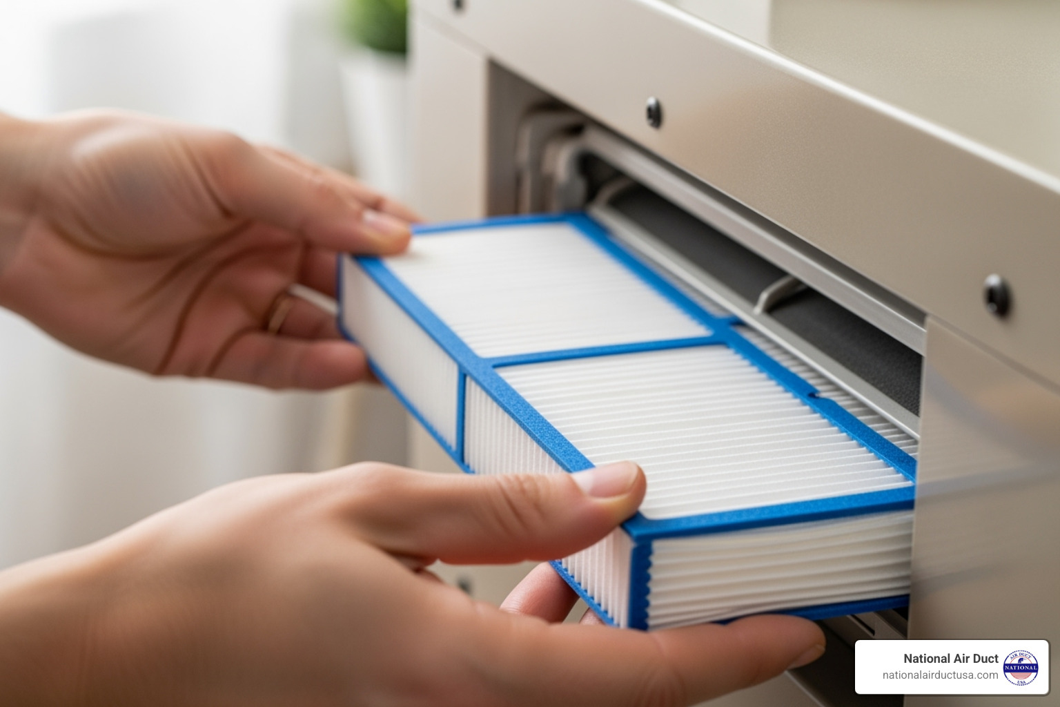 person sliding a clean new filter into an HVAC unit slot - how to clean house air conditioner