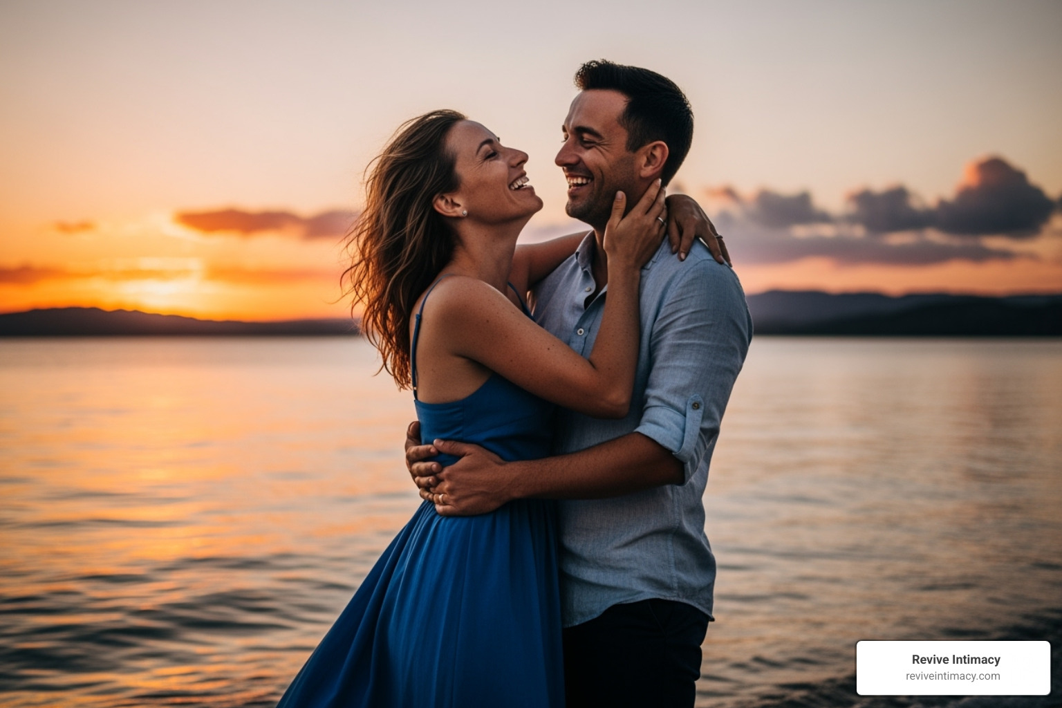 A happy, reconnected couple laughing and embracing, enjoying a beautiful sunset together, symbolizing renewed intimacy and joy. - Couples intimacy therapy