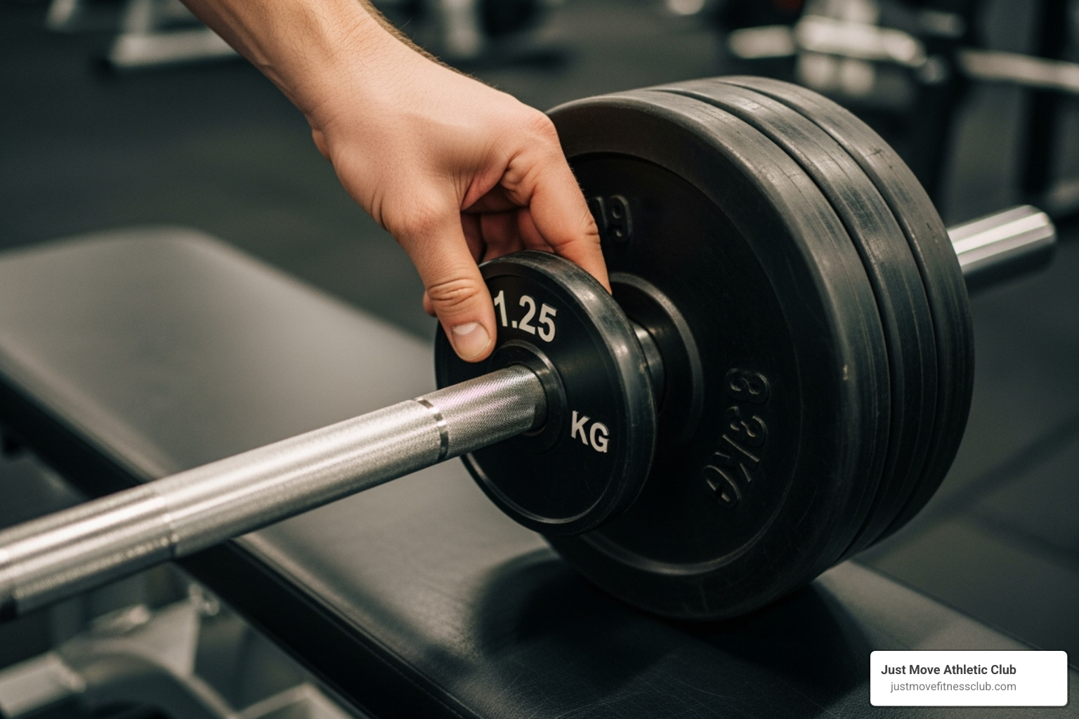 A person's hand adding a small, circular weight plate to the end of a barbell, demonstrating progressive overload - strength and muscle building workout plan A person's hand adding a small, circular weight plate to the end of a barbell, demonstrating progressive overload - strength and muscle building workout plan