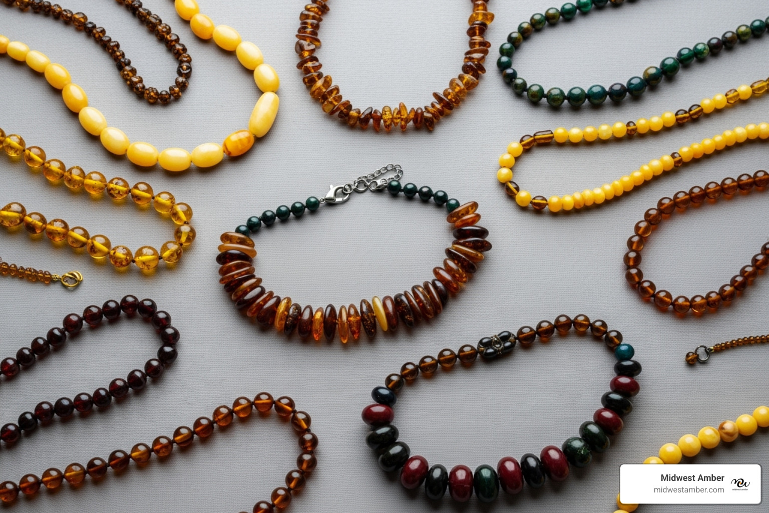 flat lay showcasing different styles of multicolor amber necklaces - multicolor amber necklace