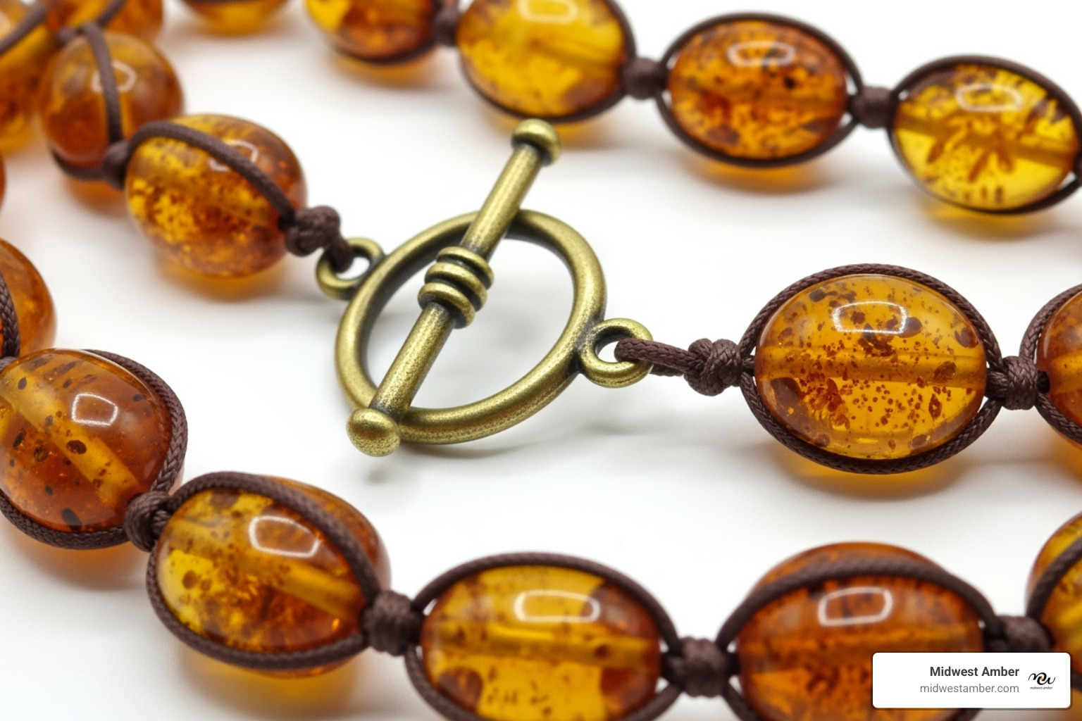 Image of a close-up on a necklace showing the knot between beads and the clasp - Baltic amber necklace