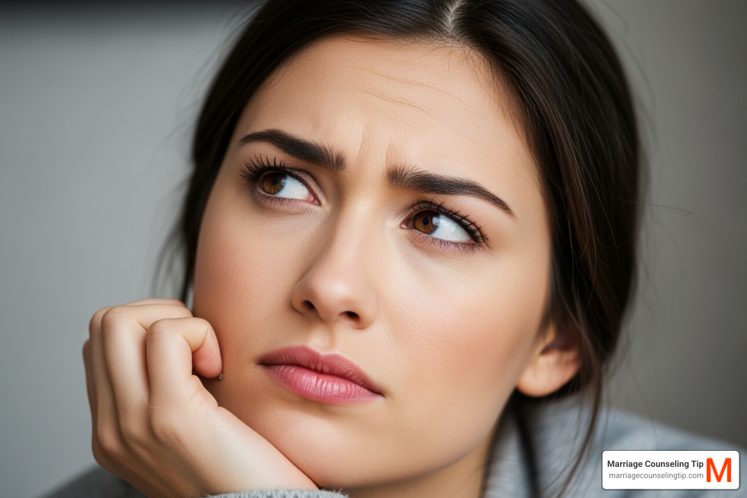 person thoughtfully considering a question about love - first love marriage