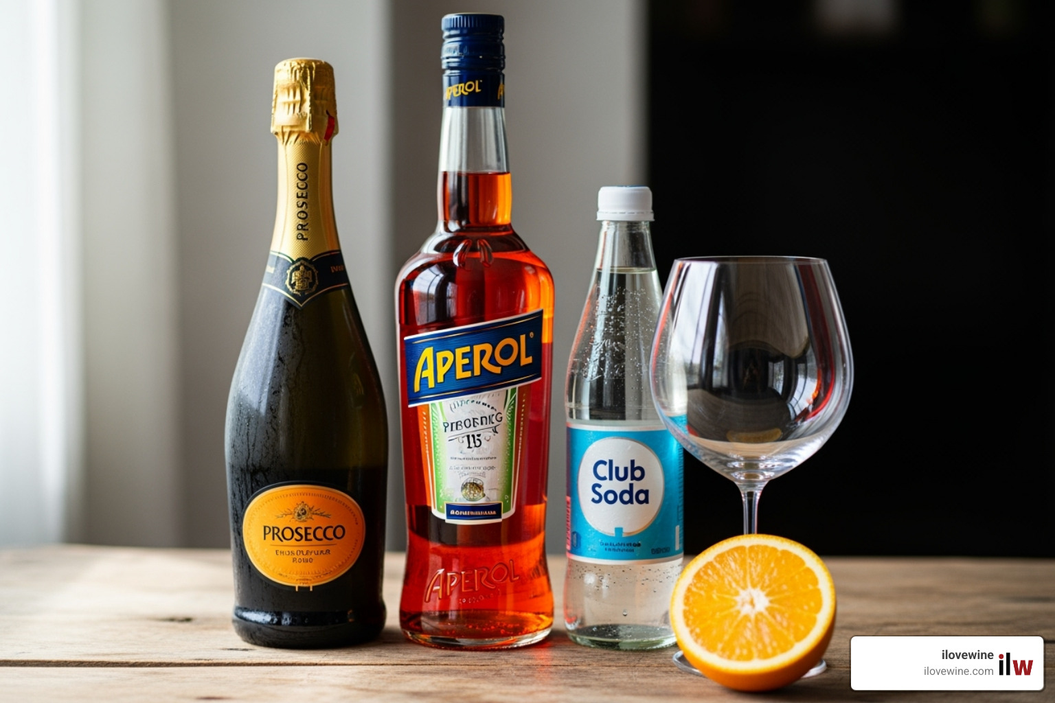 Three core ingredients for Aperol Spritz: a bottle of Aperol, a bottle of Prosecco, and a bottle of club soda, arranged with a fresh orange and a wine glass, ready for preparation. - aperol spritz cocktail Three core ingredients for Aperol Spritz: a bottle of Aperol, a bottle of Prosecco, and a bottle of club soda, arranged with a fresh orange and a wine glass, ready for preparation. - aperol spritz cocktail