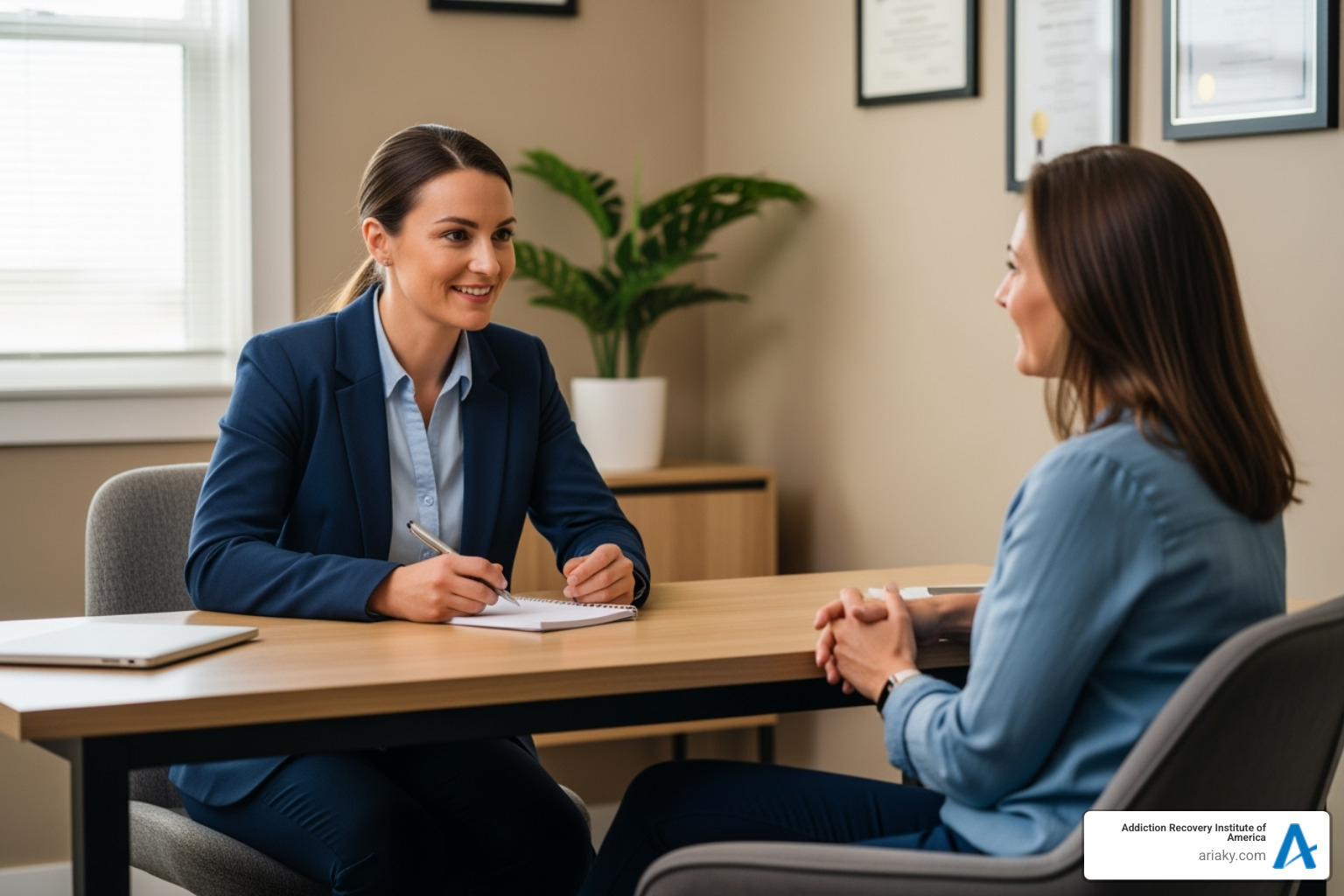 A caring admissions coordinator speaks with a client, demonstrating empathy and support - Lexington PHP treatment