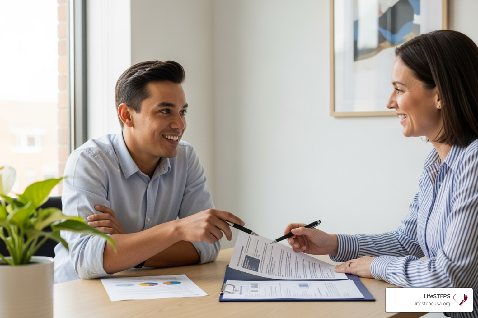 A person confidently reviewing documents with their independent support coordinator, both smiling and engaged in discussion. - independent support coordinator