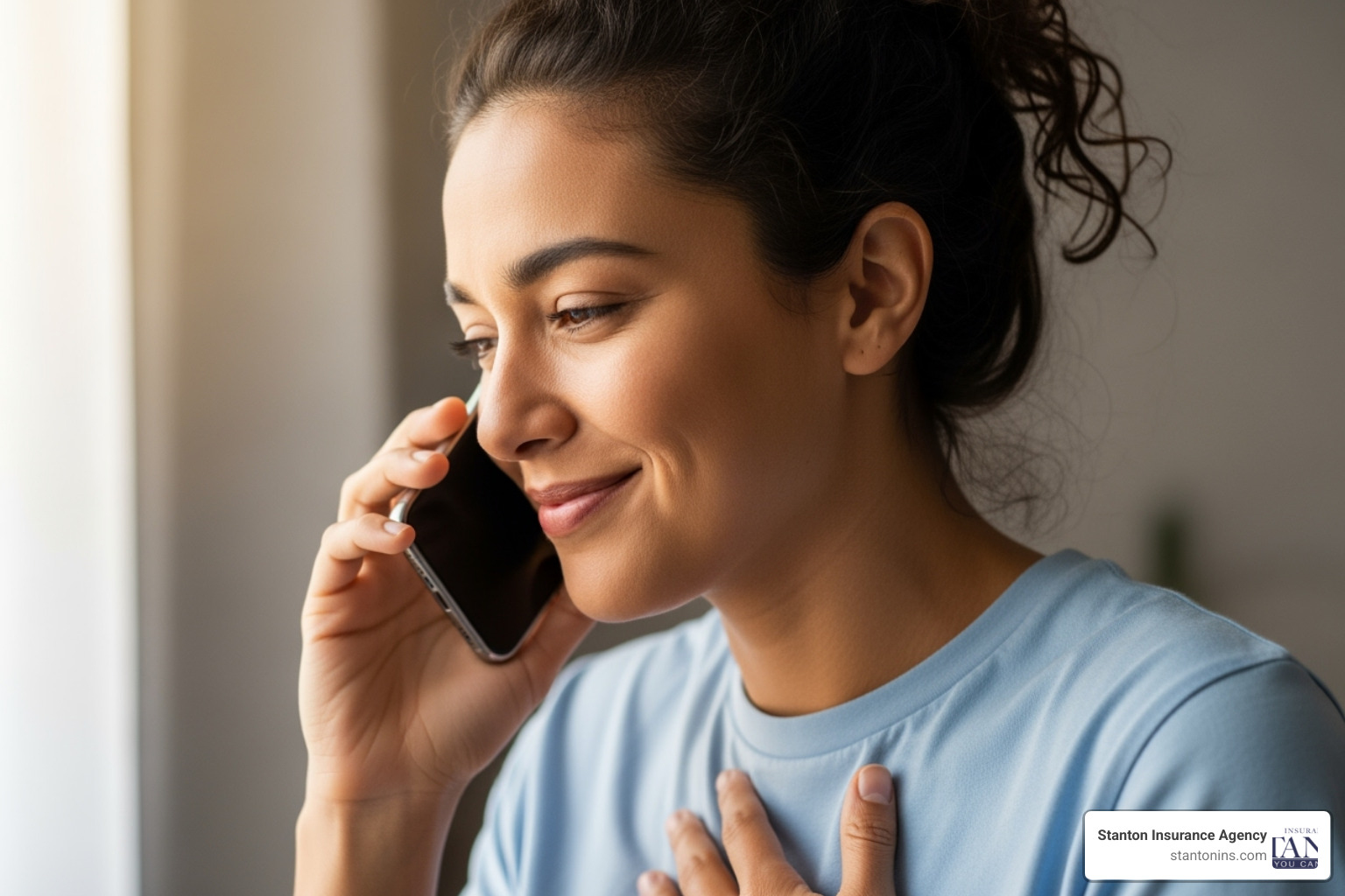 person on the phone with an insurance agent, looking relieved - um insurance meaning