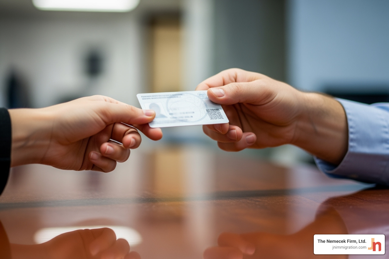 A person receiving their work authorization card - political asylum attorney