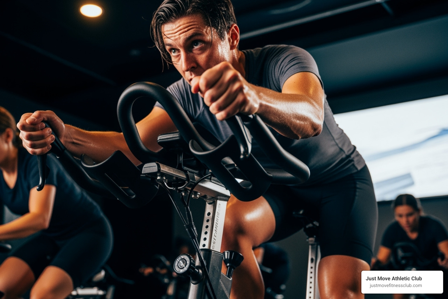 A person in "third position" during a standing climb - Spin class workout