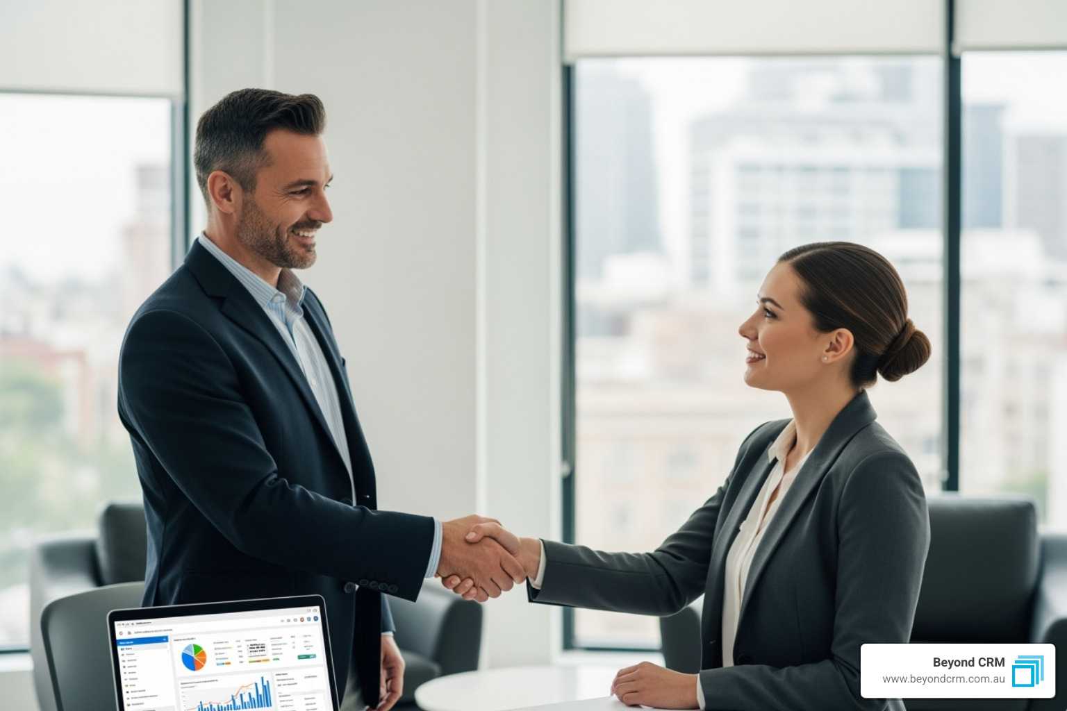 a business owner shaking hands with a CRM consultant - customize crm software