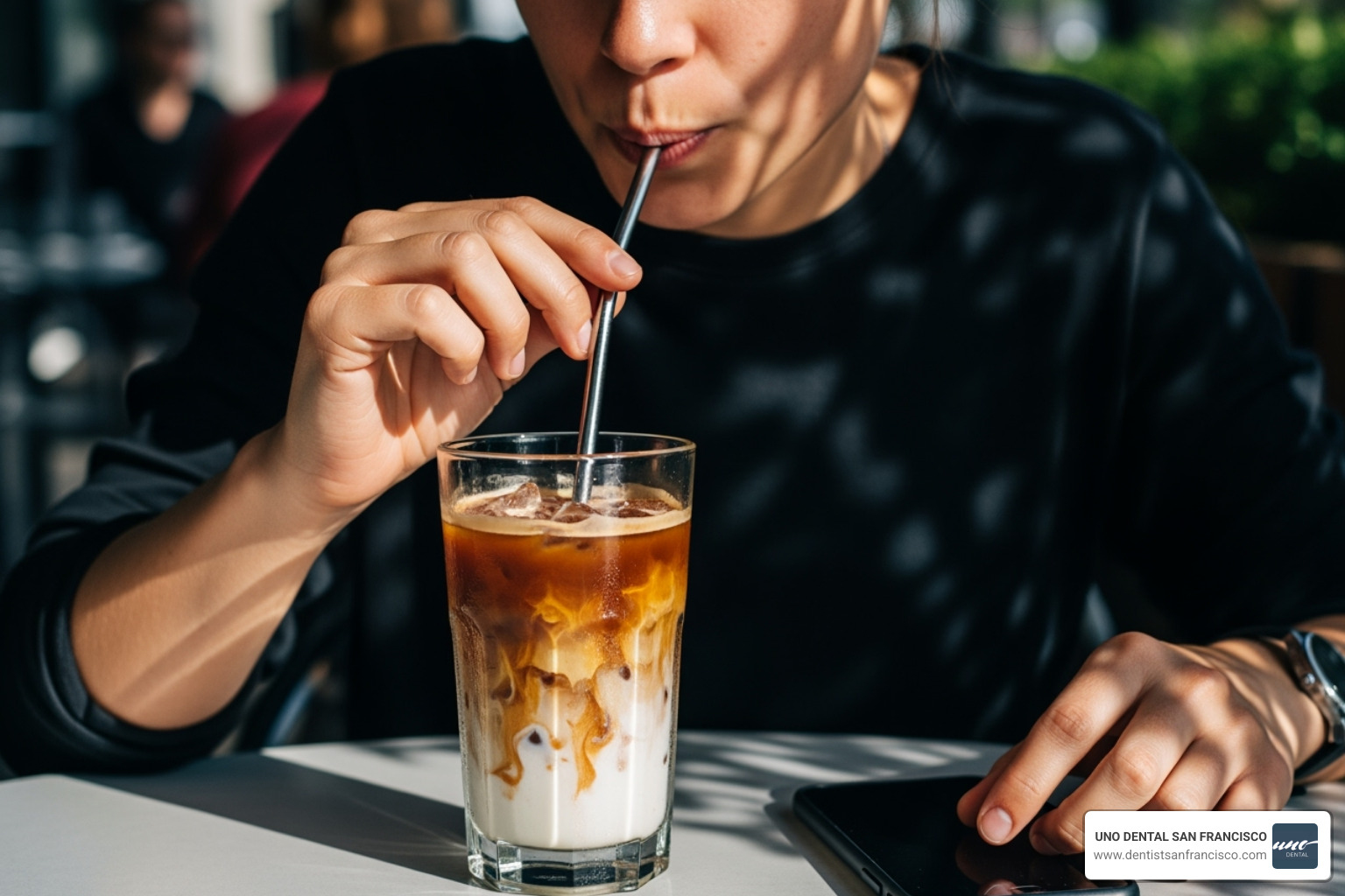 Person drinking iced coffee through a straw - get rid of coffee stains on teeth Person drinking iced coffee through a straw - get rid of coffee stains on teeth
