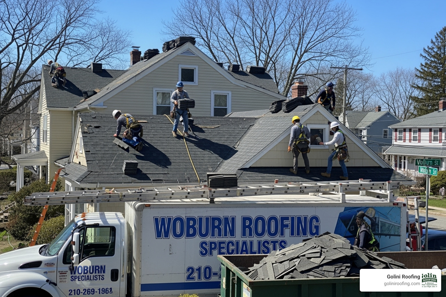High-quality architectural asphalt shingles on a residential roof - roofing company Woburn MA High-quality architectural asphalt shingles on a residential roof - roofing company Woburn MA