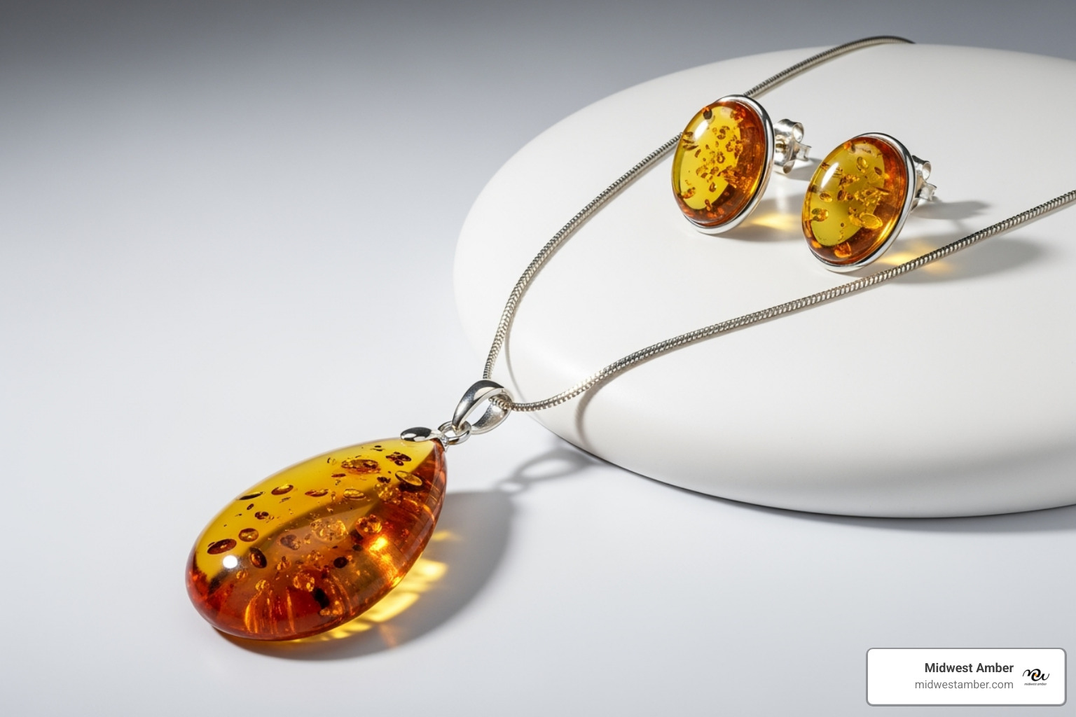 A modern amber jewelry set featuring a necklace and matching earrings. - Amber Jewelry