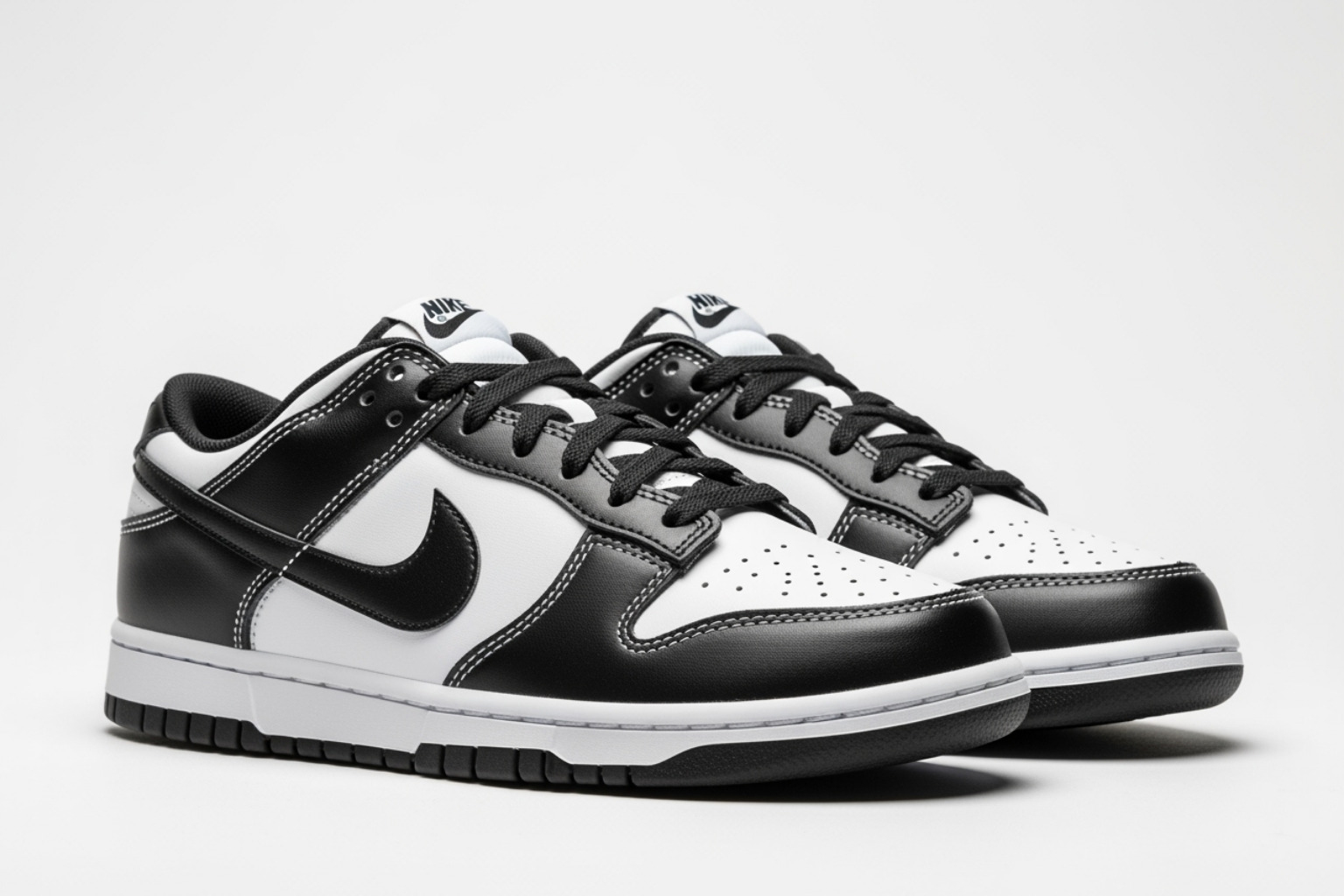 Image of the Nike Dunk Low 'Panda' on a clean background, highlighting its design details - panda dunks