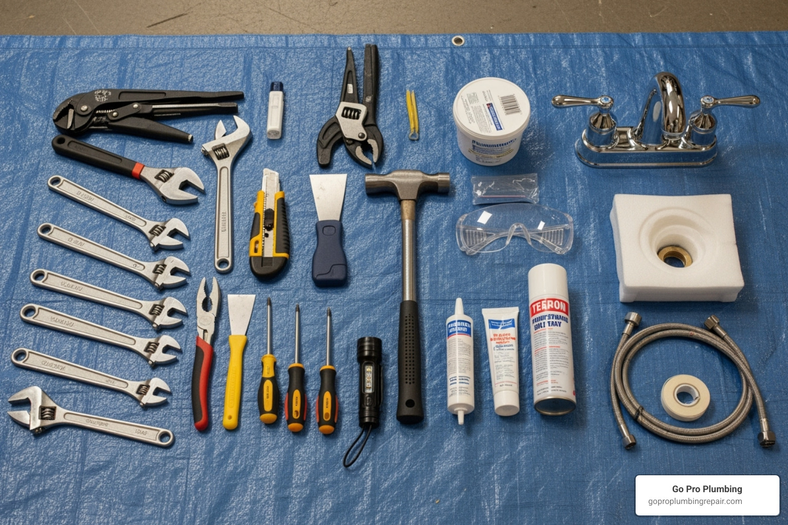 All the necessary tools and materials laid out on a tarp - pedestal sink faucet repair
