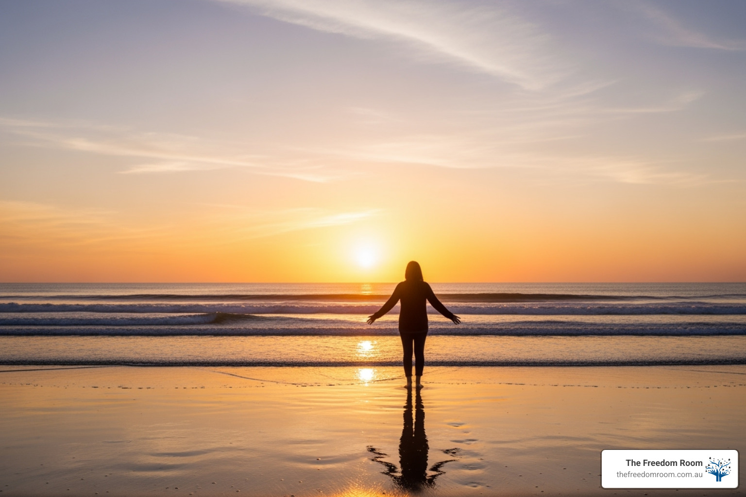 A person stands on a beach at sunrise, looking out at the ocean, symbolising hope, freedom, and a new beginning in recovery - therapy for drinking problems
