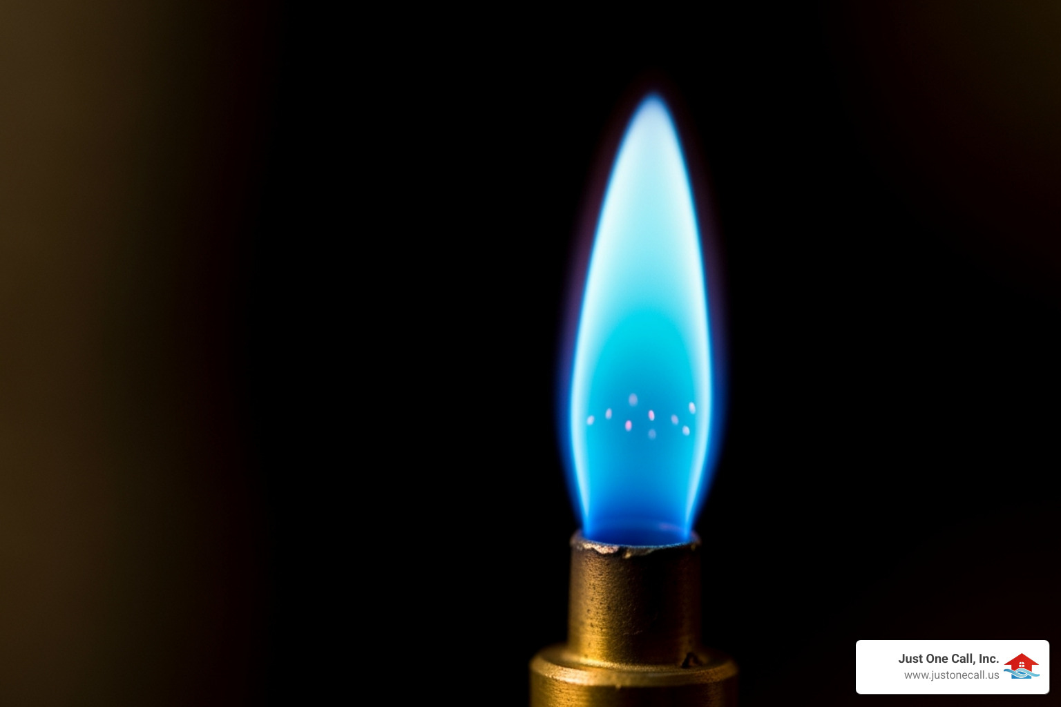 A close-up image of a furnace pilot light, showing a small, steady blue flame, indicating proper function. - 24 hour heating repair burbank