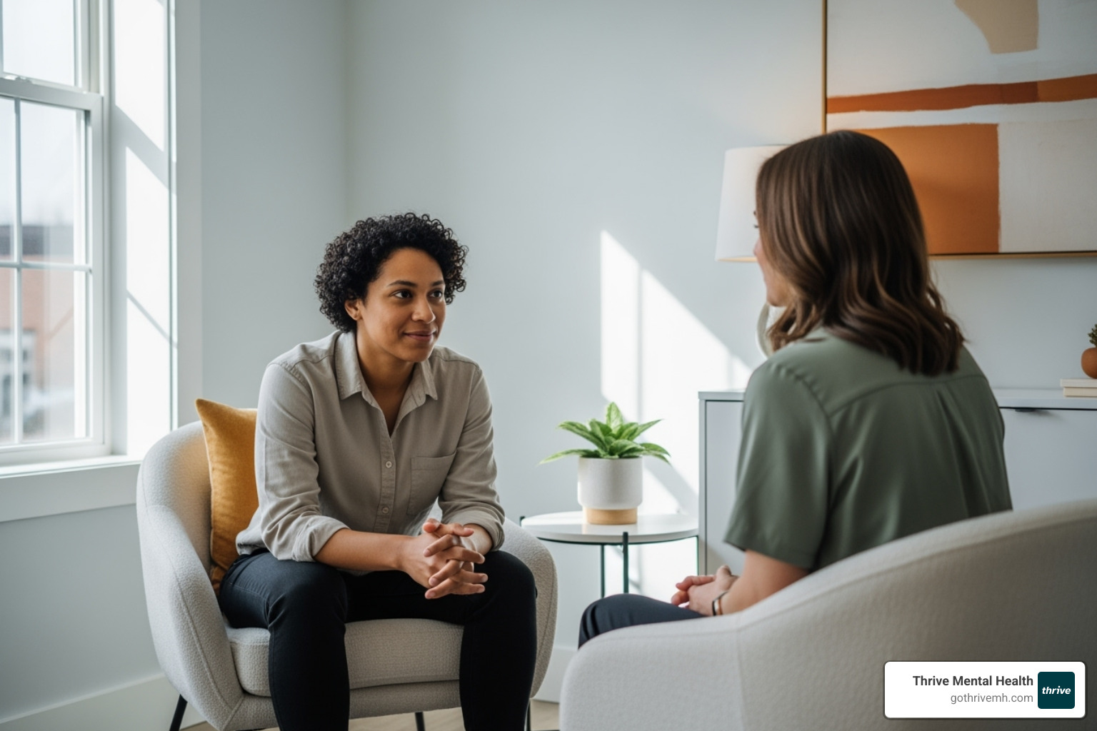A person sits across from a therapist, engaged in a one-on-one consultation, conveying trust and focused attention - iop treatment