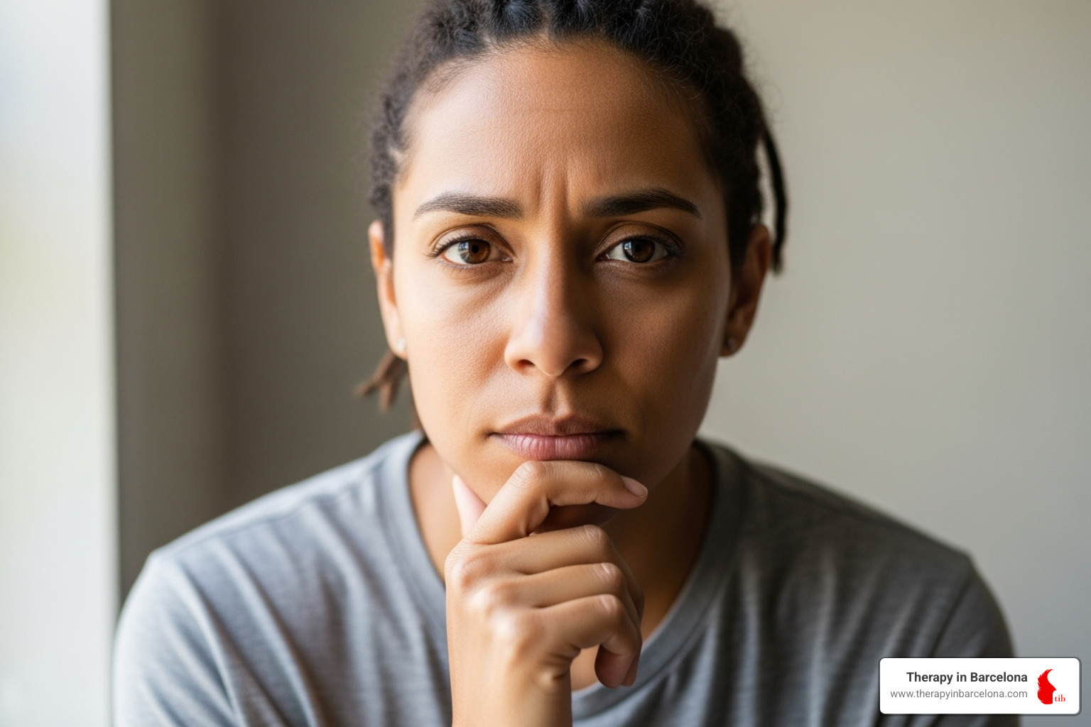 image of someone contemplating seeking help - online therapy for work stress