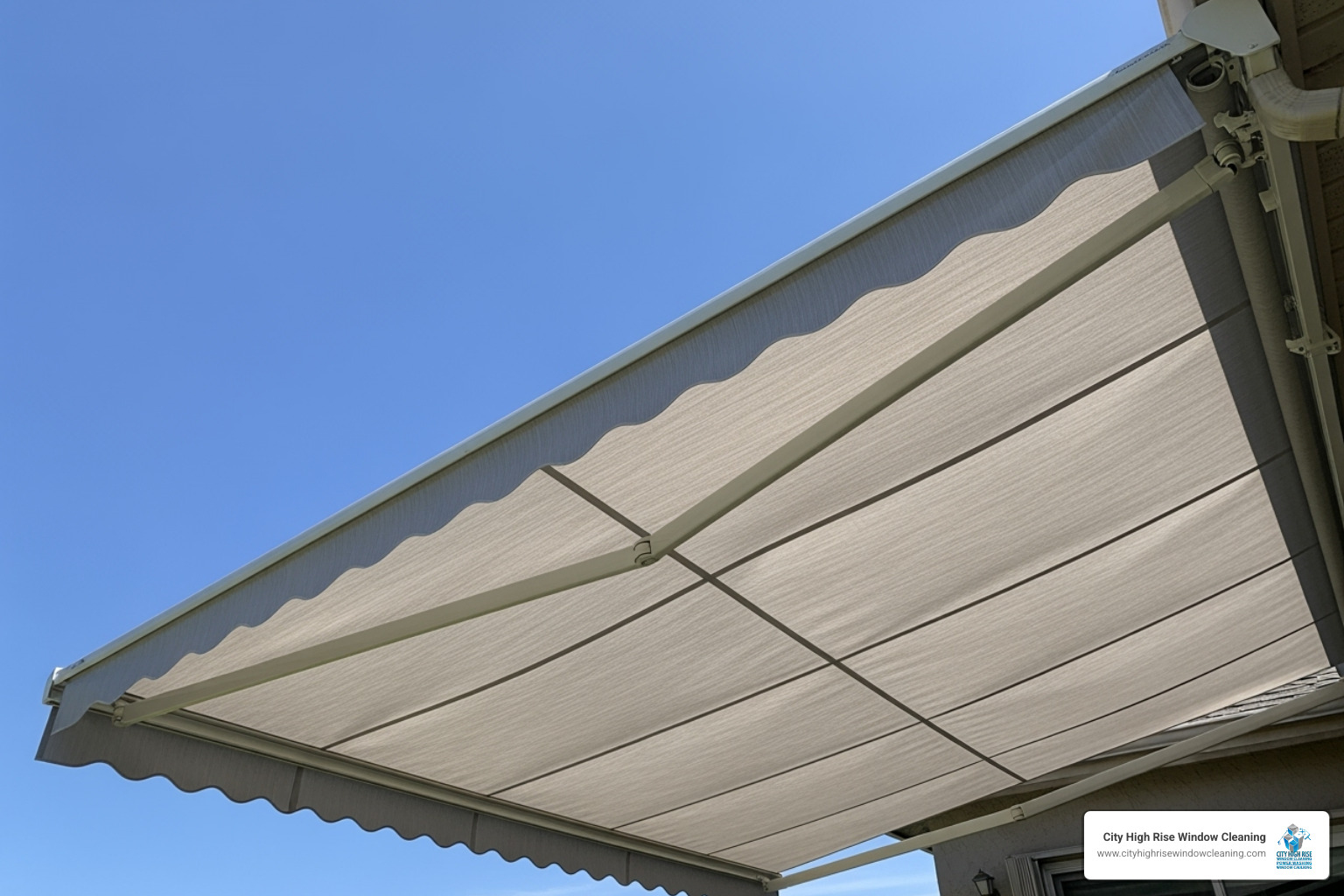 Clean, fully-extended awning air-drying in the sun - awning cleaning Clean, fully-extended awning air-drying in the sun - awning cleaning
