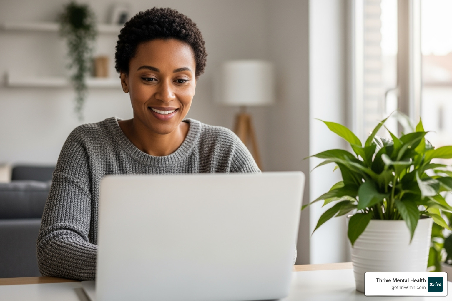 person having a productive virtual therapy session on a laptop, smiling - stress relief online person having a productive virtual therapy session on a laptop, smiling - stress relief online