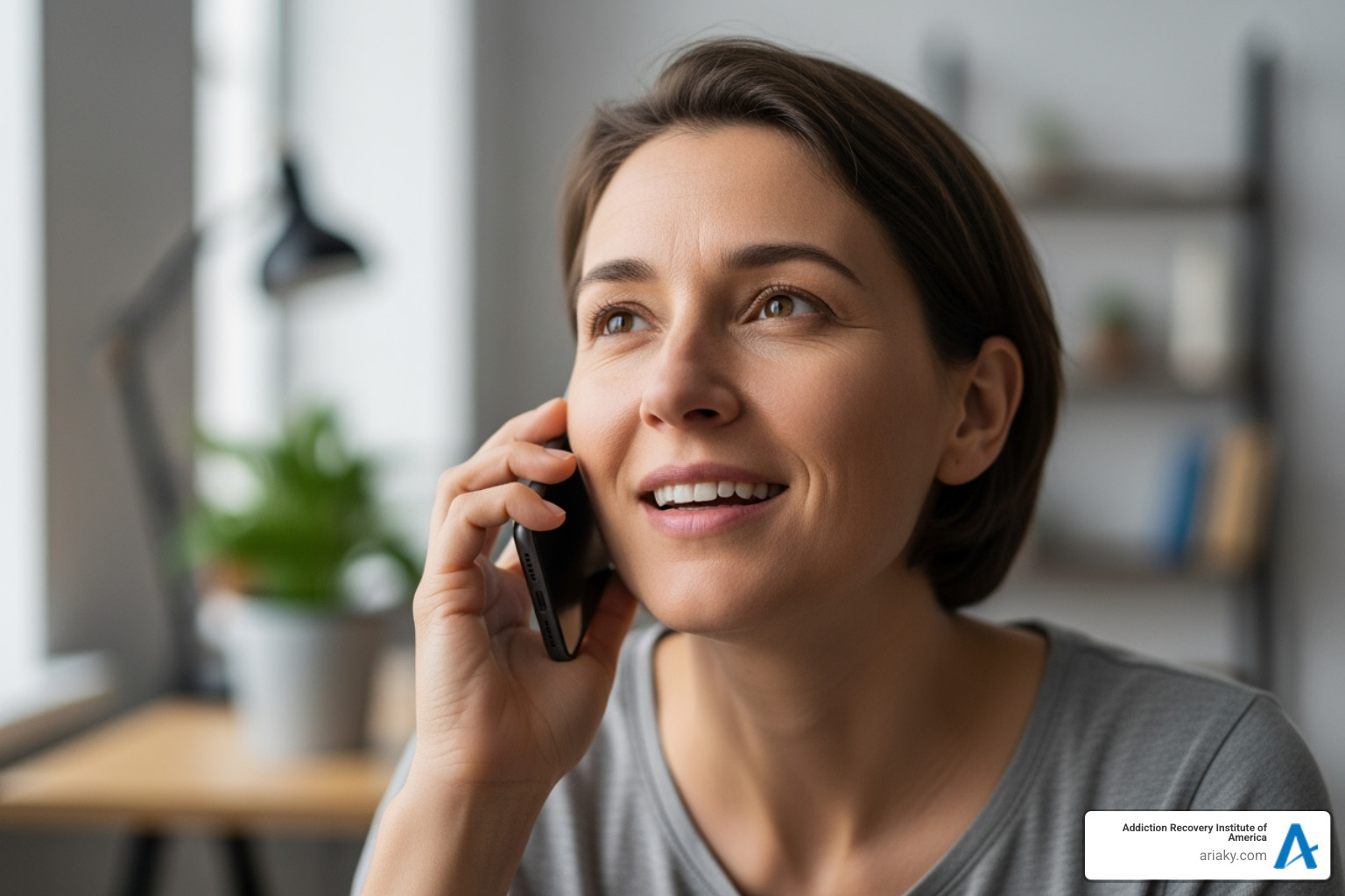 A person on the phone with an admissions coordinator, looking relieved, symbolizing the first step in seeking help for addiction - drug rehab lexington ky A person on the phone with an admissions coordinator, looking relieved, symbolizing the first step in seeking help for addiction - drug rehab lexington ky