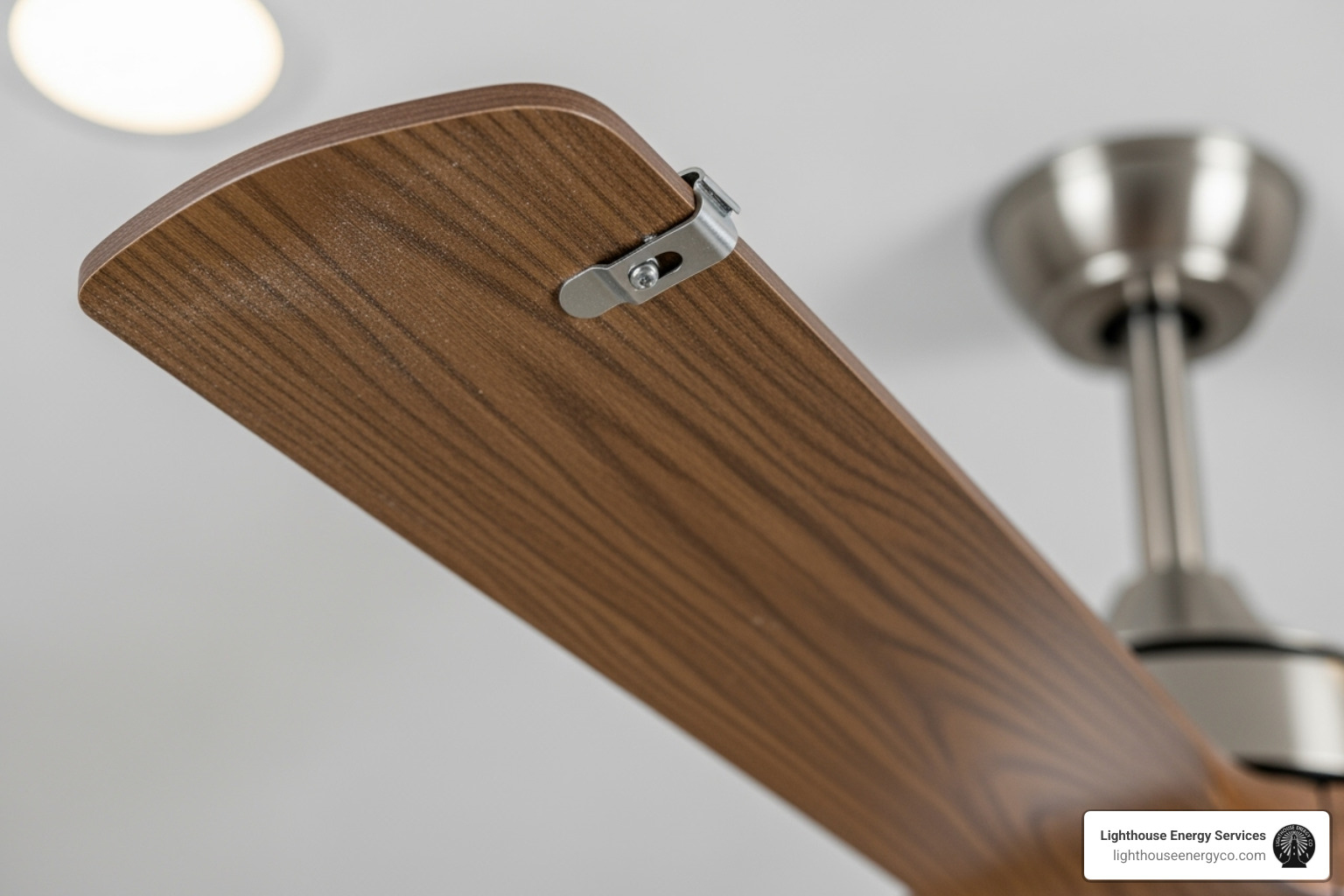 Close-up of a ceiling fan blade being balanced - electrician to install ceiling fan Close-up of a ceiling fan blade being balanced - electrician to install ceiling fan