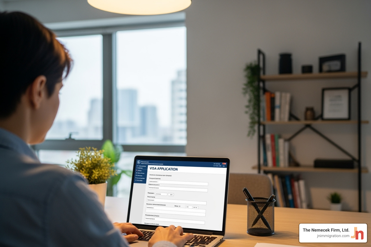 person filling out an online visa application form - Non-immigrant visa lawyer