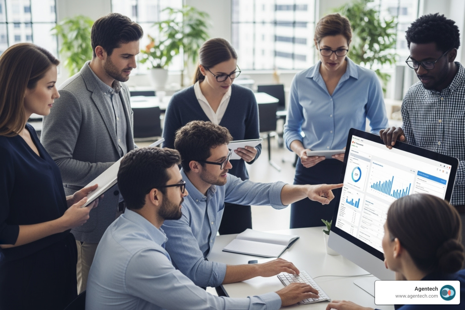 team evaluating claims management software options on a screen - insurance back office software