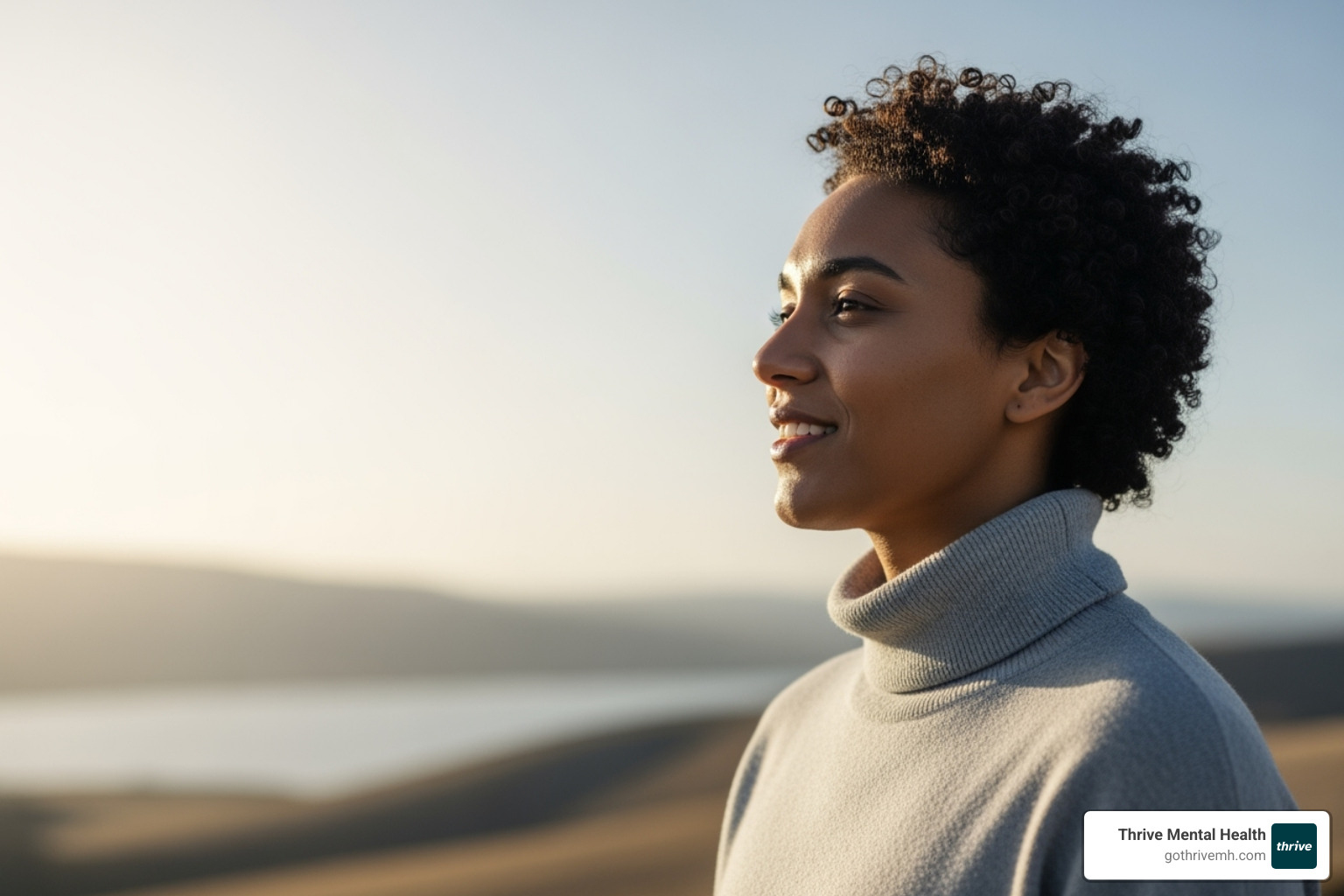 person smiling and looking confidently into the distance, symbolizing renewed focus and control - adhd in adults medication