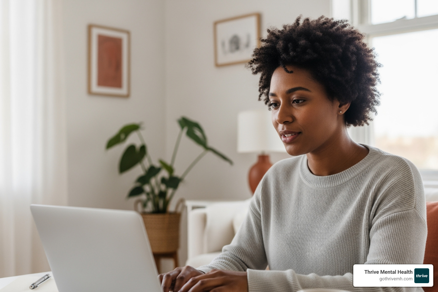 Person in a virtual therapy session with a laptop, looking engaged and focused - how cognitive behavioral therapy works Person in a virtual therapy session with a laptop, looking engaged and focused - how cognitive behavioral therapy works