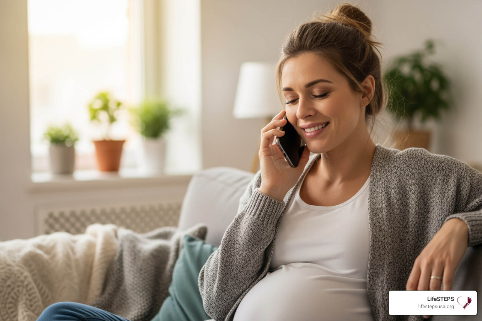 a woman on a phone, looking relieved while talking to a support worker - emergency housing for pregnant single mothers a woman on a phone, looking relieved while talking to a support worker - emergency housing for pregnant single mothers