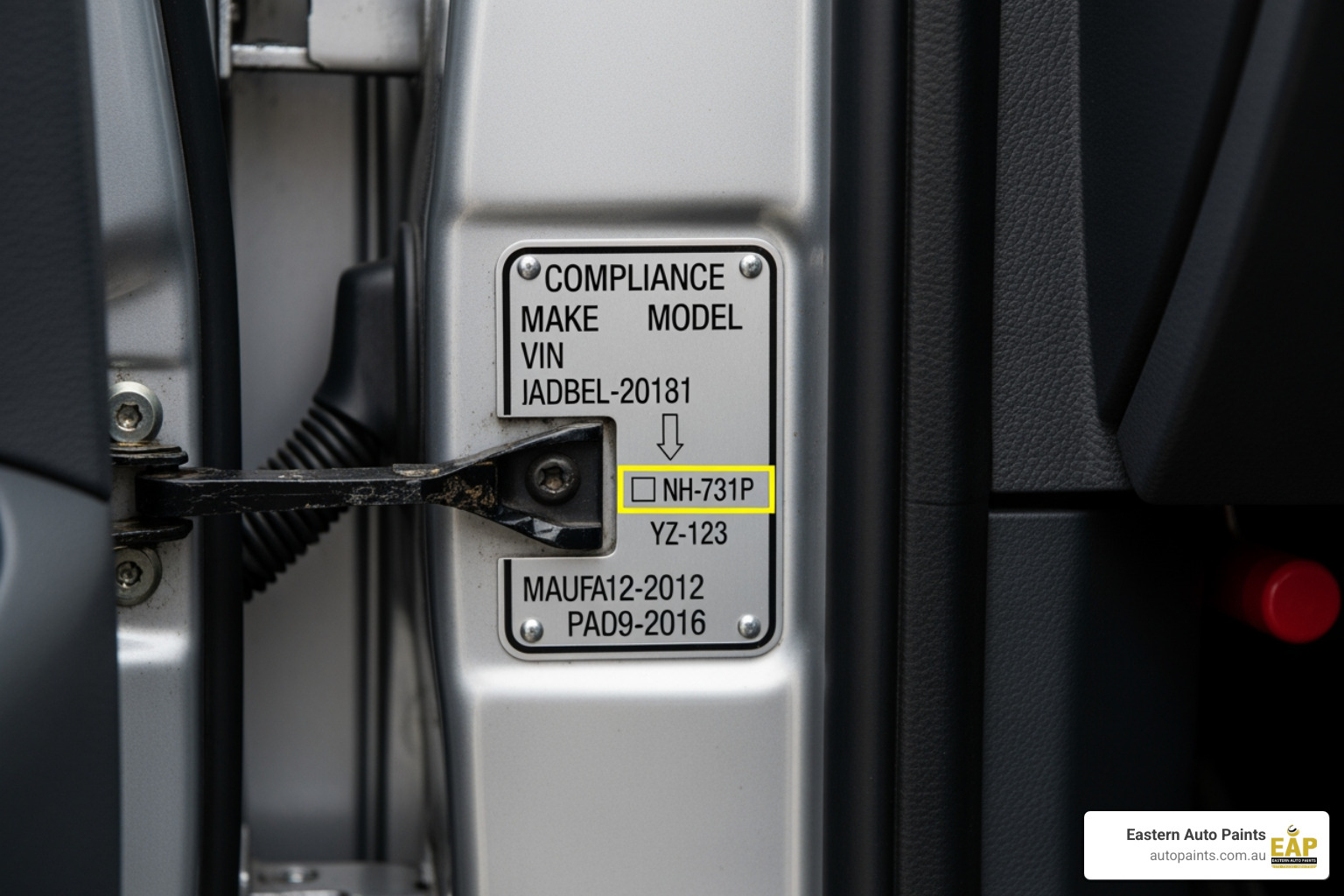 Compliance plate showing vehicle's paint code (NH-731P) required to order the matching touch up paint spray can.