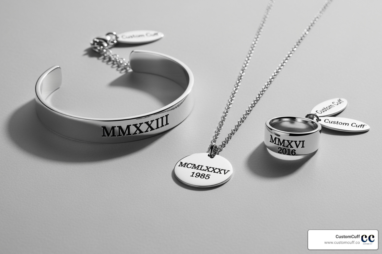 flat lay featuring a Custom Cuff bracelet, necklace, and ring with Roman numerals - custom roman numeral jewelry