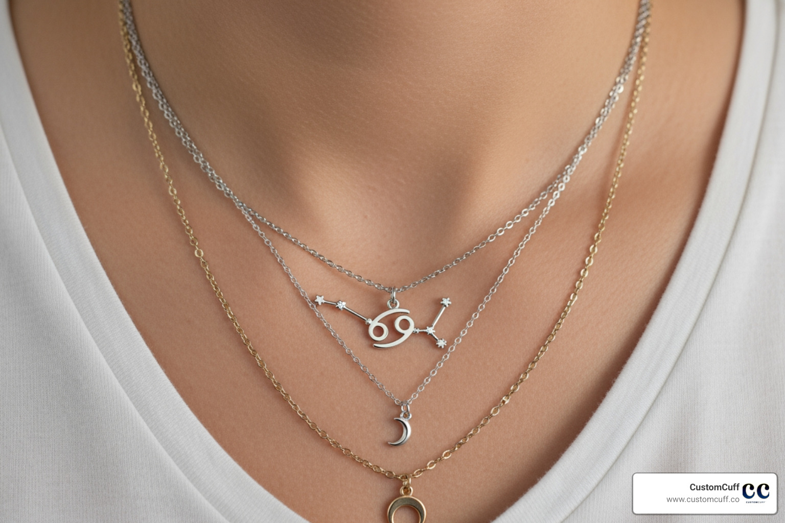 person layering a Cancer constellation necklace with a simple chain and a moon pendant - cancer zodiac sign necklace