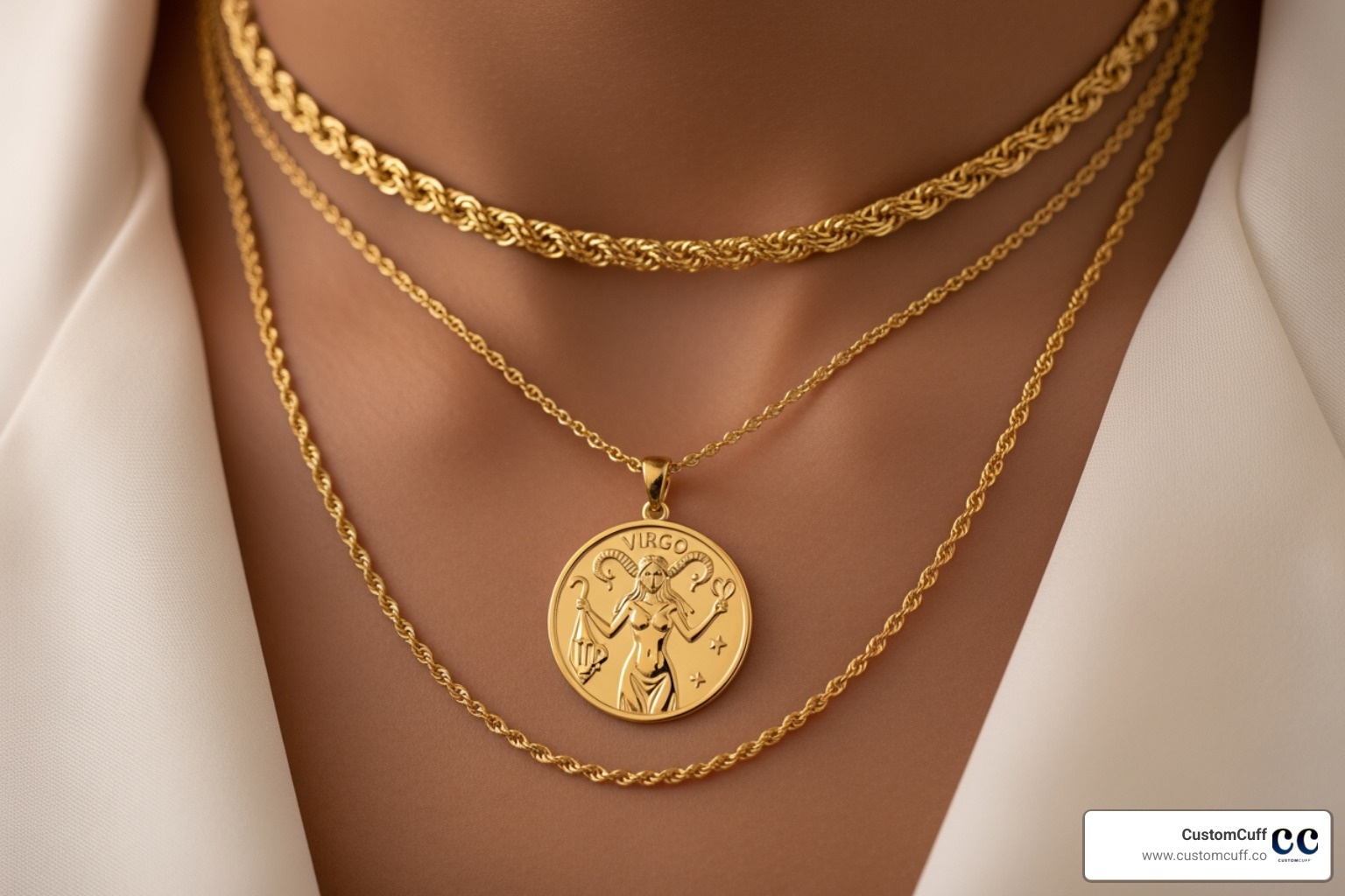 Solid gold Virgo necklace layered with a shorter and a longer chain. Alt text: "Layered solid gold Virgo necklaces." - solid gold virgo necklace